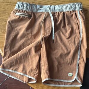 Vuori Athletic Shorts in Tan and Cream